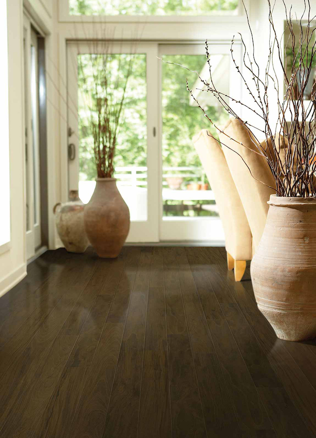 dark wood look laminate flooring in an earth toned dining room